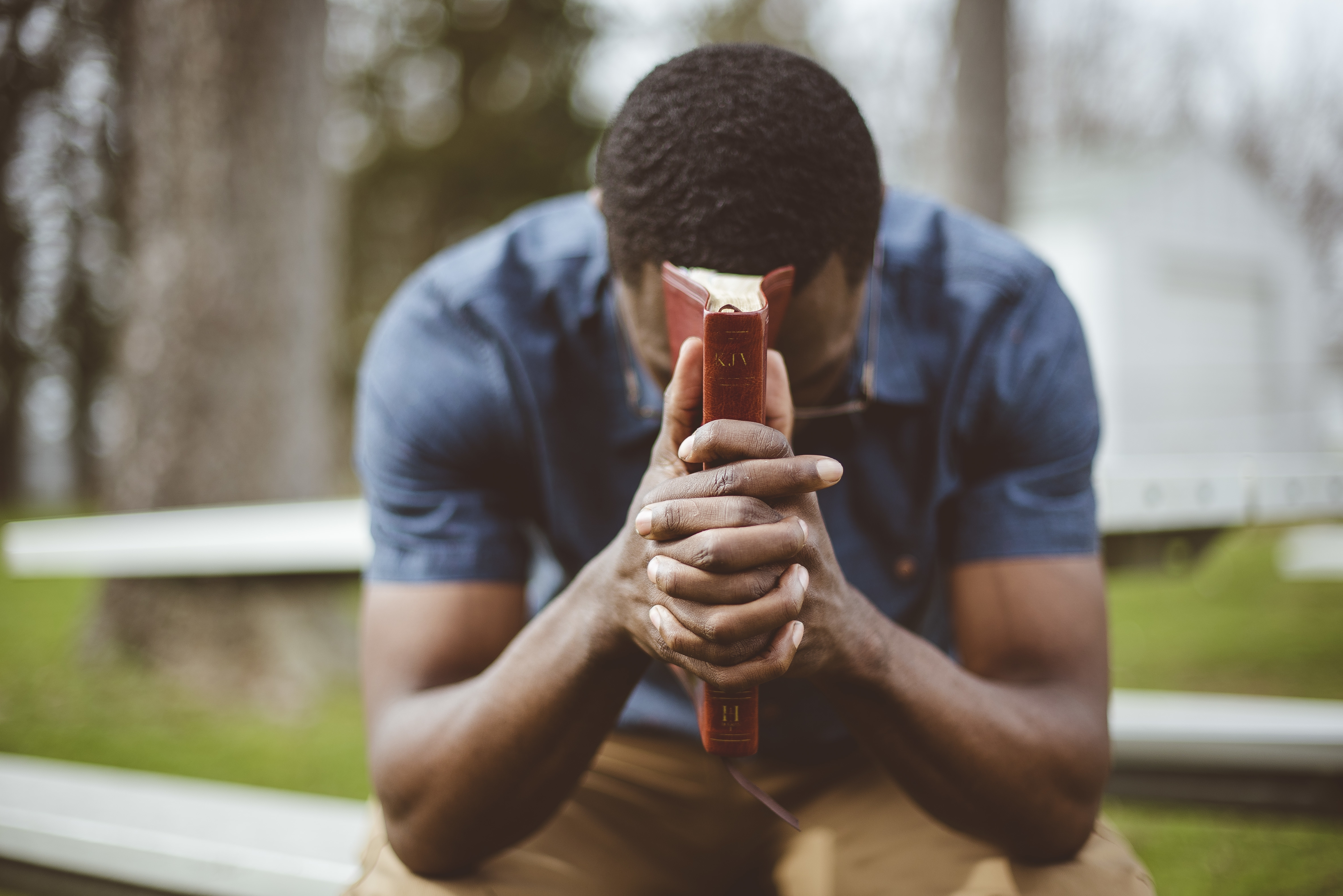young-african-american-male-sitting-with-closed-eyes-with-bible-his-hands.jpg (8.63 MB)